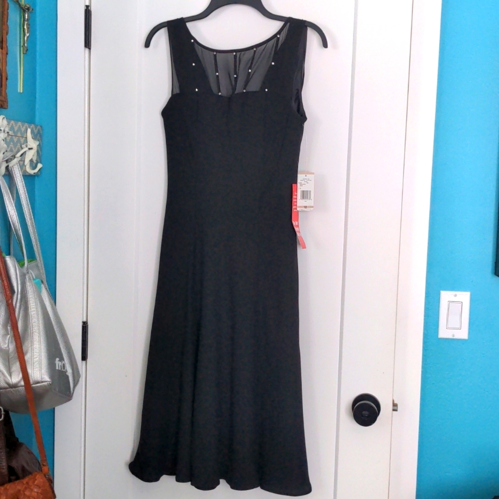 Elegant black cocktail dress with "crystal" detailing and draped back